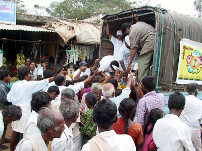 Distributing the excess prasadam in Kotacheruvu